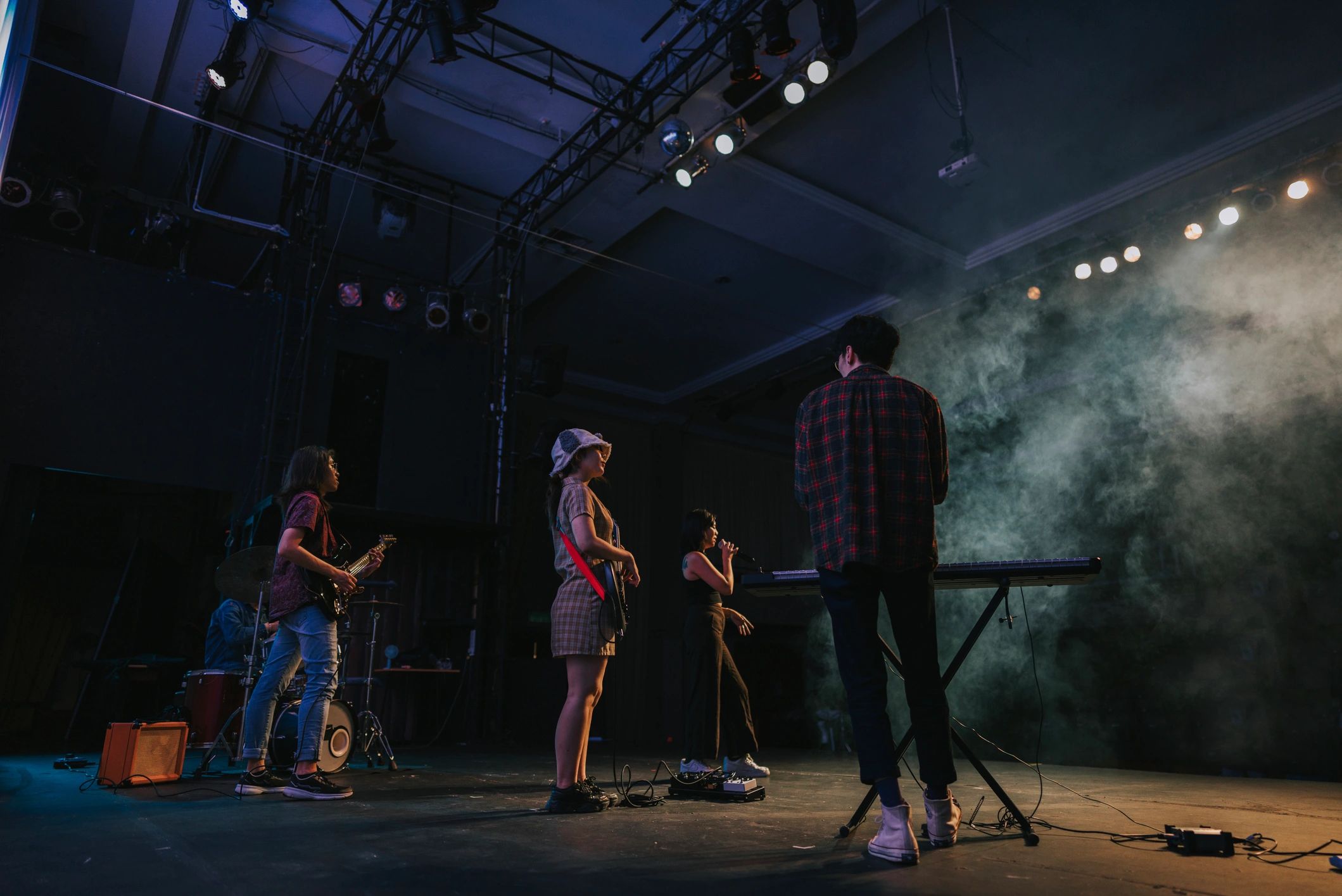 Concert-style live event production with performers on stage